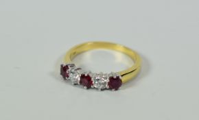 A GOOD DIAMOND & RUBY RING IN 18CT YELLOW GOLD composed of a row of three rubies alternating with