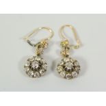 A GOOD PAIR OF ANTIQUE DIAMOND CLUSTER EARRINGS each cluster composed of ten round brilliant cut