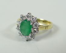 A GOOD DIAMOND & EMERALD FLORAL RING IN 18CT YELLOW GOLD composed of ten bright white round cut