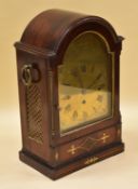 A GEORGE IV TWIN FUSEE BRACKET CLOCK chiming on bells, the case in brass inlaid rosewood and the