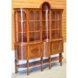 A FINE QUALITY INLAID MAHOGANY DISPLAY CABINET having a cupboard base raised over a platform and