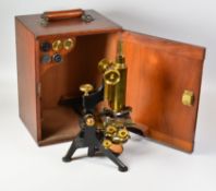 A W WATSONS & SONS CASED MONOCULAR MICROSCOPE in painted steel and brass with various lenses on