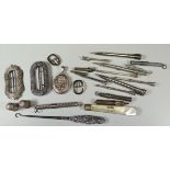 A MIXED PARCEL OF SMALL SILVER ITEMS including belt-buckles and approx eleven pencils