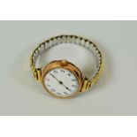 A VINTAGE 9CT GOLD ENCASED WRISTWATCH on expanding bracelet