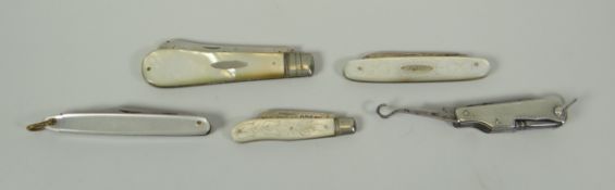 FOUR MOTHER-OF-PEARL HANDLED FRUIT-KNIVES, three with silver blades; together with a miniature