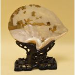 A JAPANESE MOTHER-OF-PEARL TABLE SCREEN on a naturalistic carved hardwood stand, the shell gold