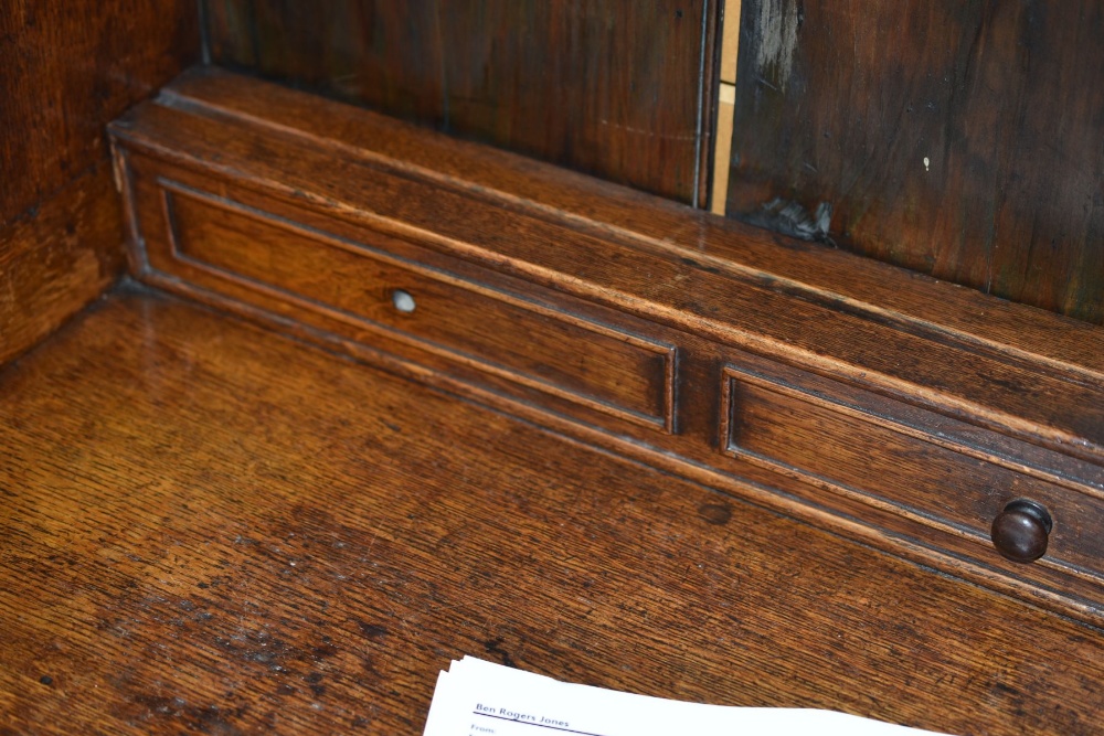 AN OAK WELSH DRESSER BASE with a good borded rack with two shelves, shaped sides and with old hooks, - Image 3 of 6