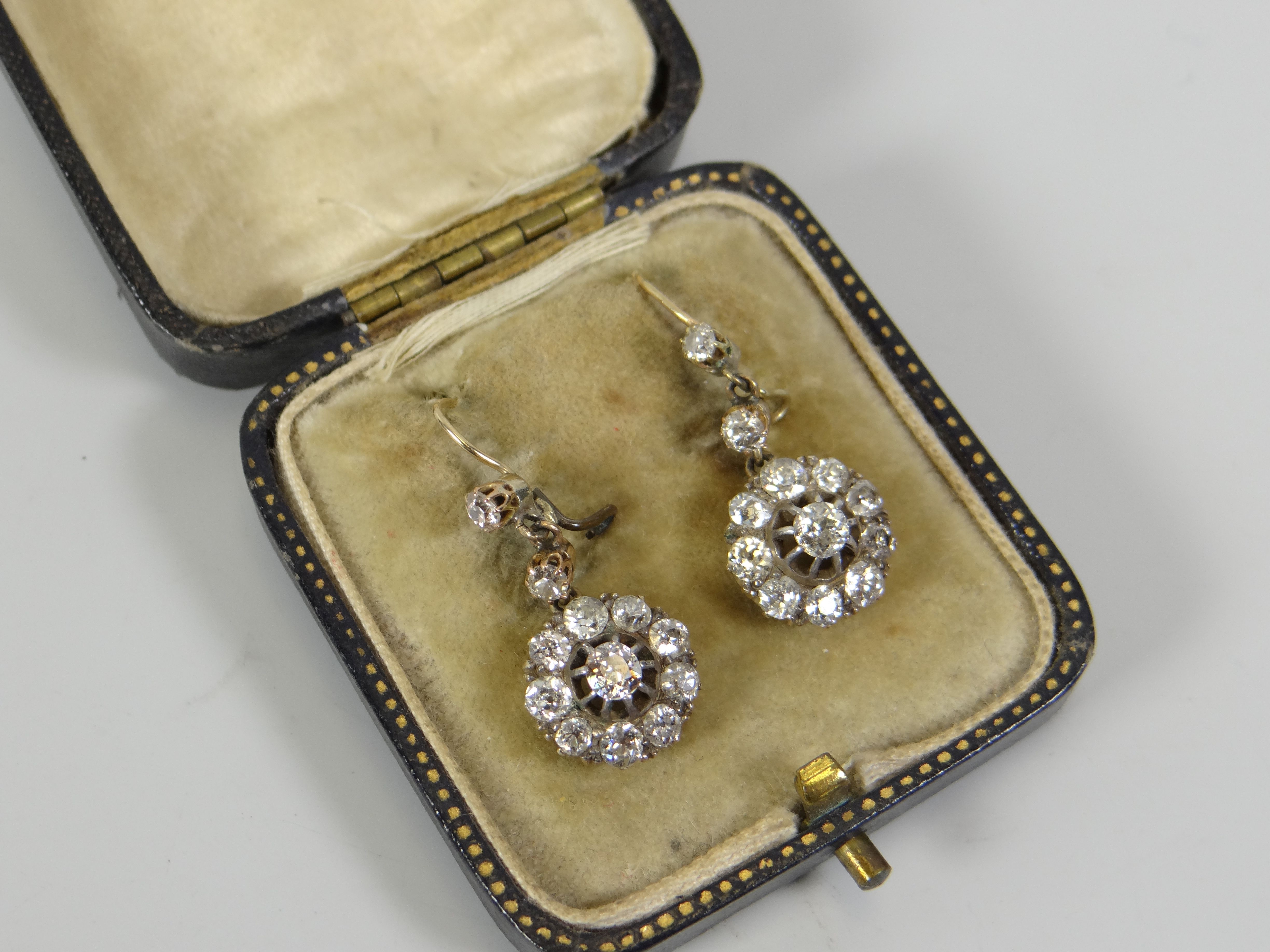 A GOOD PAIR OF ANTIQUE DIAMOND CLUSTER EARRINGS each cluster composed of ten round brilliant cut - Image 3 of 3