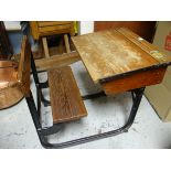 AN ENGLISH VINTAGE SCHOOL DESK & SEAT made by Kingfisher Ltd from wood with iron base, the slope