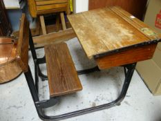 AN ENGLISH VINTAGE SCHOOL DESK & SEAT made by Kingfisher Ltd from wood with iron base, the slope