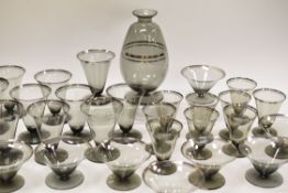 A SET OF CZECHOSLAVAKIAN DRINKING GLASSES combining twenty seven flutes in three sizes and ten