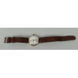A VINTAGE 9CT GOLD ENCASED WRISTWATCH on later tan leather strap, the dial with Roman numerals and
