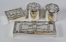 A QUALITY FOUR PIECE SILVER DRESSING-TABLE SET comprising large and small rectangular boxes together