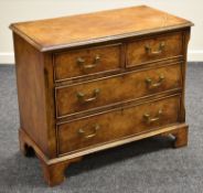 AN ANTIQUE REPRODUCTION WALNUT CHEST of two long and two short drawers in a Georgian style with