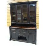A STAINED OAK EDWARDIAN DRESSER composed of a base with dog kennel, three drawers and flanking
