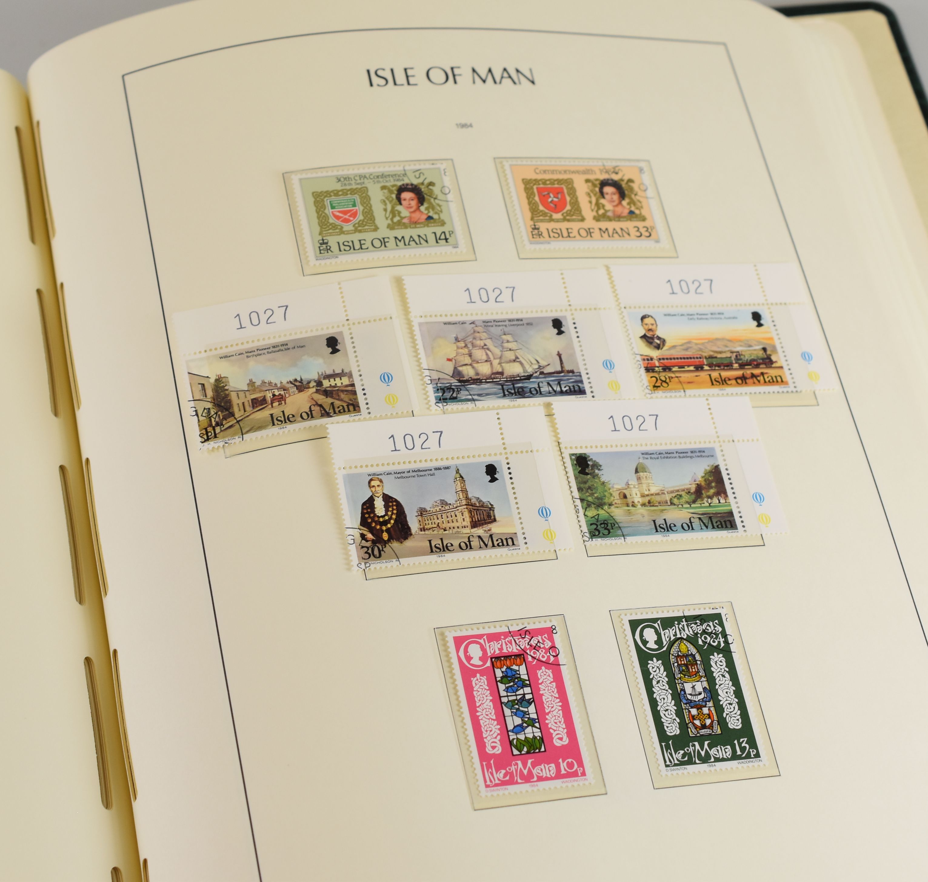 A COMPREHENSIVELY FILLED GREEN ALBUM OF ISLE OF MAN STAMPS professionally completed from 1973