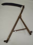 A NINETEENTH CENTURY ENGLISH SCYTHE with forked wooden handles, stretcher and twin grips (repair