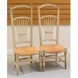 A PAIR OF FRENCH PAINTED PINE FARMHOUSE CHAIRS with rush seats and wheat kernel backs