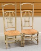 A PAIR OF FRENCH PAINTED PINE FARMHOUSE CHAIRS with rush seats and wheat kernel backs