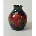 A MOORCROFT POMEGRANATE VASE of globular form with narrow neck, 10cms high