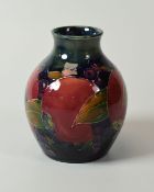 A MOORCROFT POMEGRANATE VASE of globular form with narrow neck, 10cms high