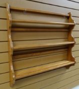 AN ERCOL LIGHTWOOD THREE-SHELF PLATE RACK 83cms wide