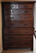 AN ANTIQUE RESTORED CHEST ON CHEST composed of six long drawers and two short with Grecian key