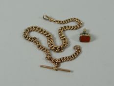 A 9CT GOLD GRADUATED MUFF-CHAIN with t-bar, 26gms; together with a fob