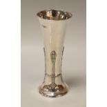 A SILVER TRUMPET VASE having a spreading foot and with raised decoration, London 1904, 8.2ozs