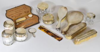 A PARCEL OF PART SILVER DRESSING TABLE ITEMS including brushes, jars and cased part-manicure set
