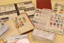 A BOX OF STAMPS IN FOLDERS & ALBUMS including blue folder of 1st day covers, three packets of 1st