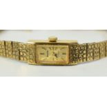 A 9CT YELLOW GOLD LADIES BRACELET WATCH BY ACCURIST '17 JEWELS' with winding mechanism and having