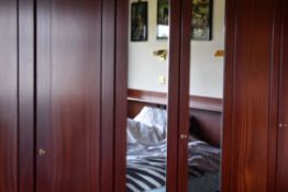 A HULSTA FURNITURE SUITE OF THREE TALL WARDROBES (value dependant on dismantling and assembling)