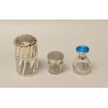 THREE SILVER LIDDED DRESSING-TABLE BOTTLES comprising a fluted example, a guilloche enamel lidded