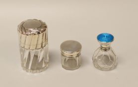 THREE SILVER LIDDED DRESSING-TABLE BOTTLES comprising a fluted example, a guilloche enamel lidded