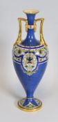 A ROYAL WORCESTER TWIN HANDLED VASE of ovoid form with slender narrow neck, the handles and rims