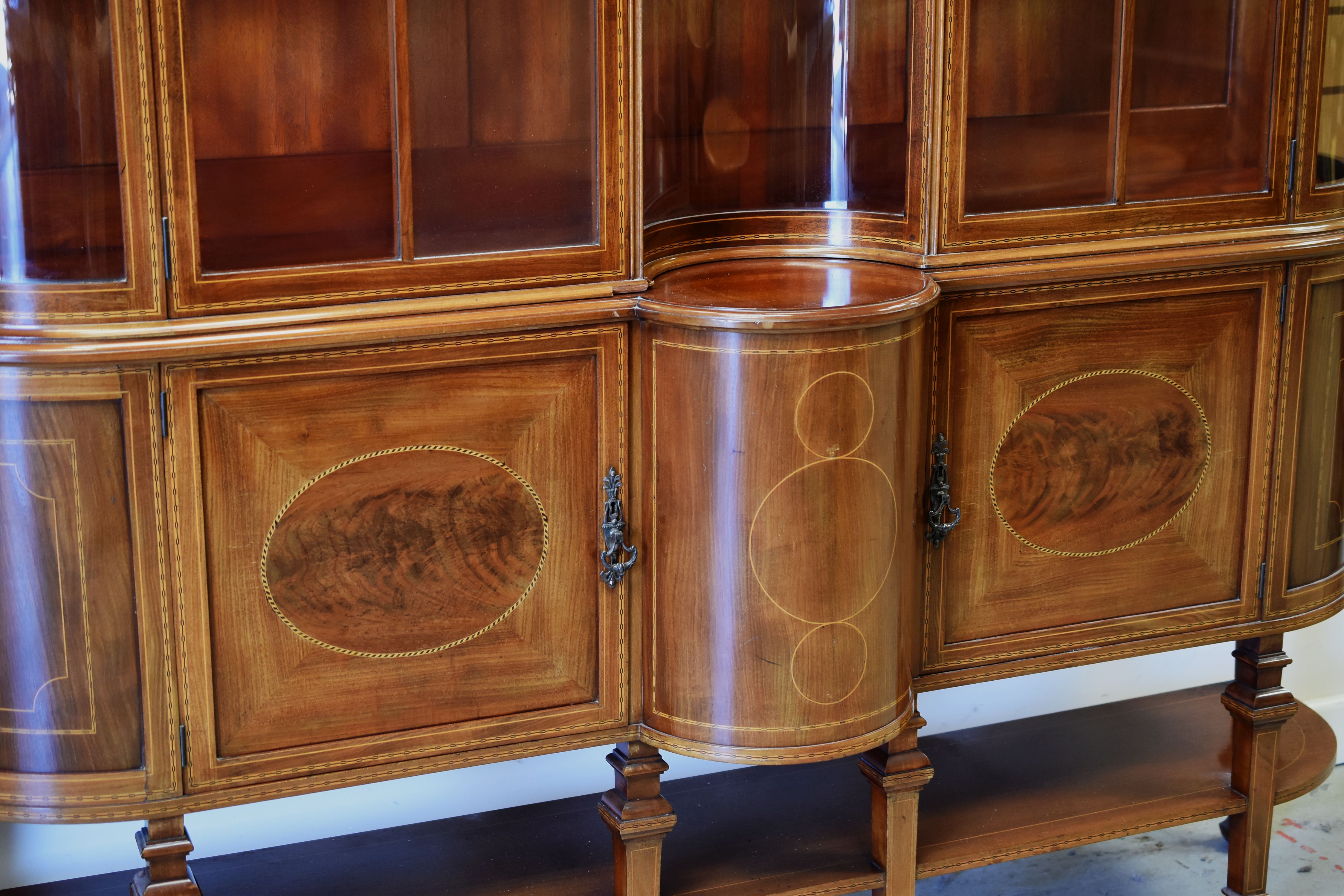 A FINE QUALITY INLAID MAHOGANY DISPLAY CABINET having a cupboard base raised over a platform and - Image 2 of 10