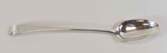 A LONG HANDLED GEORGE III SILVER SERVING SPOON, of plain form with monogrammed terminal, London