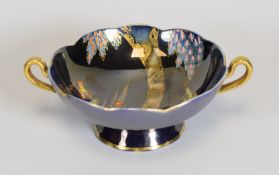 A CARLTONWARE TWIN-HANDLED FOOTED DISH of lobed circular form, with purple lustre reserve and with
