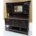 A TURN OF THE CENTURY STAINED MAHOGANY MIRROR BACK SIDEBOARD raised on platform base with two centre