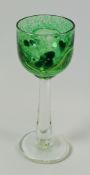 A GEORGE ELLIOTT ART GLASS having a tall tapering clear glass stem and spreading foot to a mottled