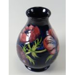 A MOORCROFT ANEMONE POTTERY VASE, 13.5cms high