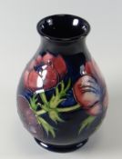 A MOORCROFT ANEMONE POTTERY VASE, 13.5cms high