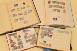 A GREEN NEW AGE STAMP ALBUM QE issues 1952-62, approx. 10-20% complete, together with unnamed blue
