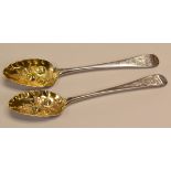 A PAIR OF GEORGE IV SILVER BERRY SPOONS the gilded bowls with raised berry and leaf decoration and