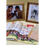 AUTOGRAPH OF MUHAMMAD ALI on a colour photographic print of Ali and Joe Frazier, both signatures,