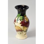 A 1998 MOORCROFT VASE in two tone reserve with tube-lined orchids, 19cms high