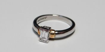 A BAGUETTE DIAMOND SOLITAIRE RING IN PLATINUM SETTING, 5.3gms