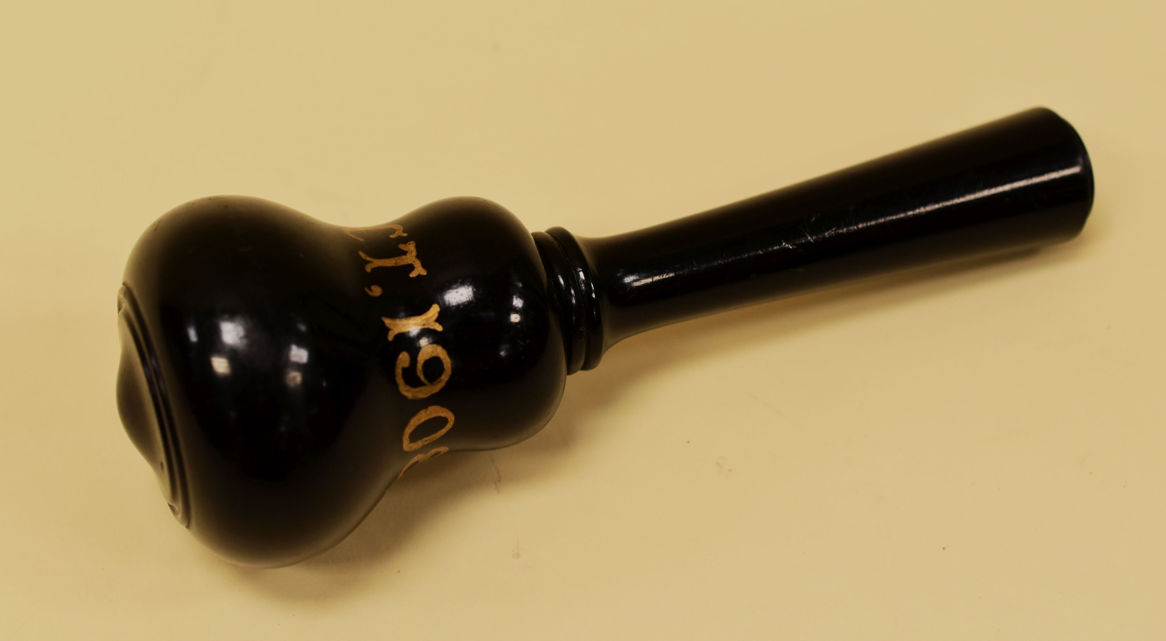 AN EBONY / EBONISED GAVEL with gold lettering '10th Oct, 1908', 18cms high