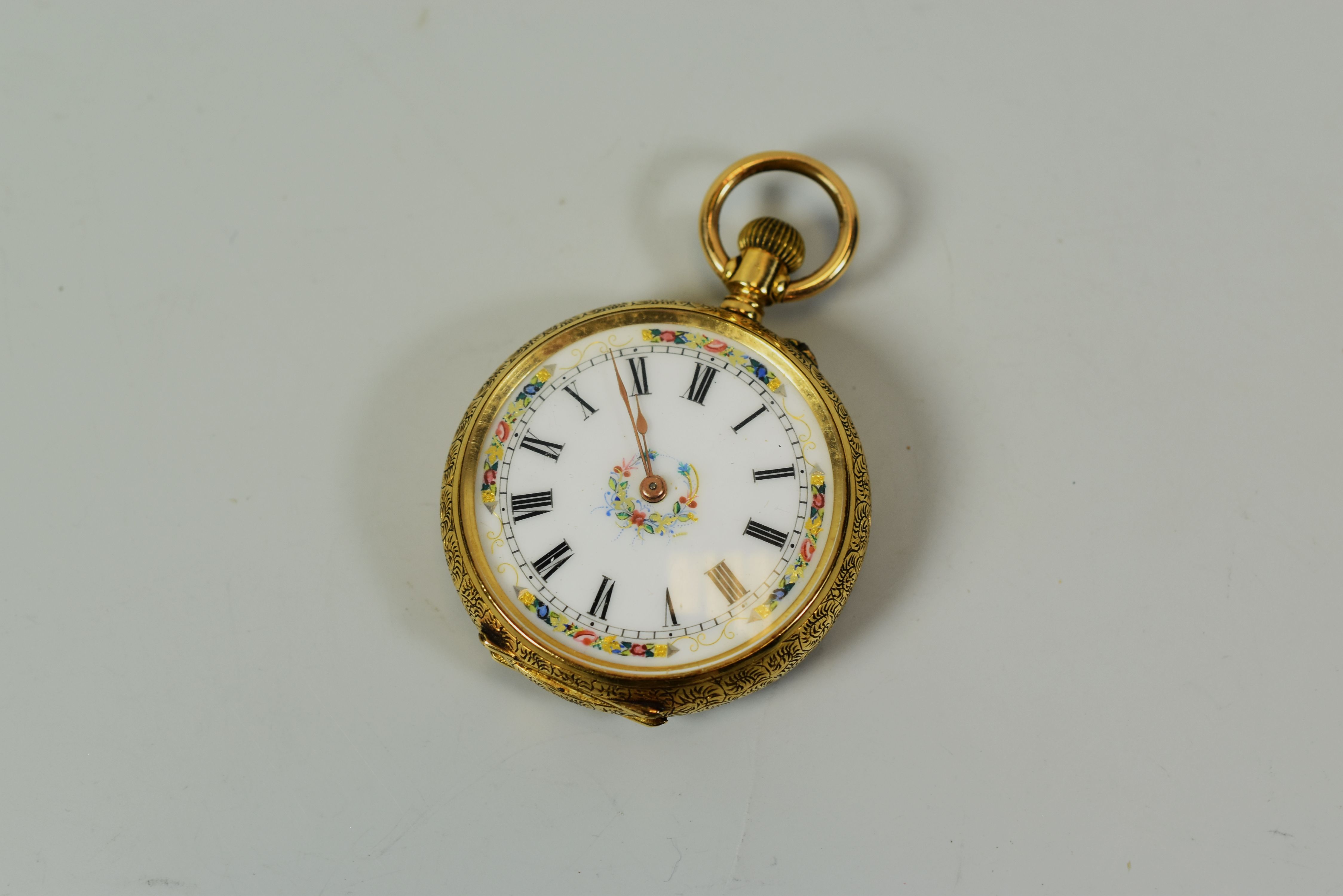 AN 18K YELLOW GOLD LADIES FOB WATCHES open-faced with stem wind, the dial with Roman numerals and